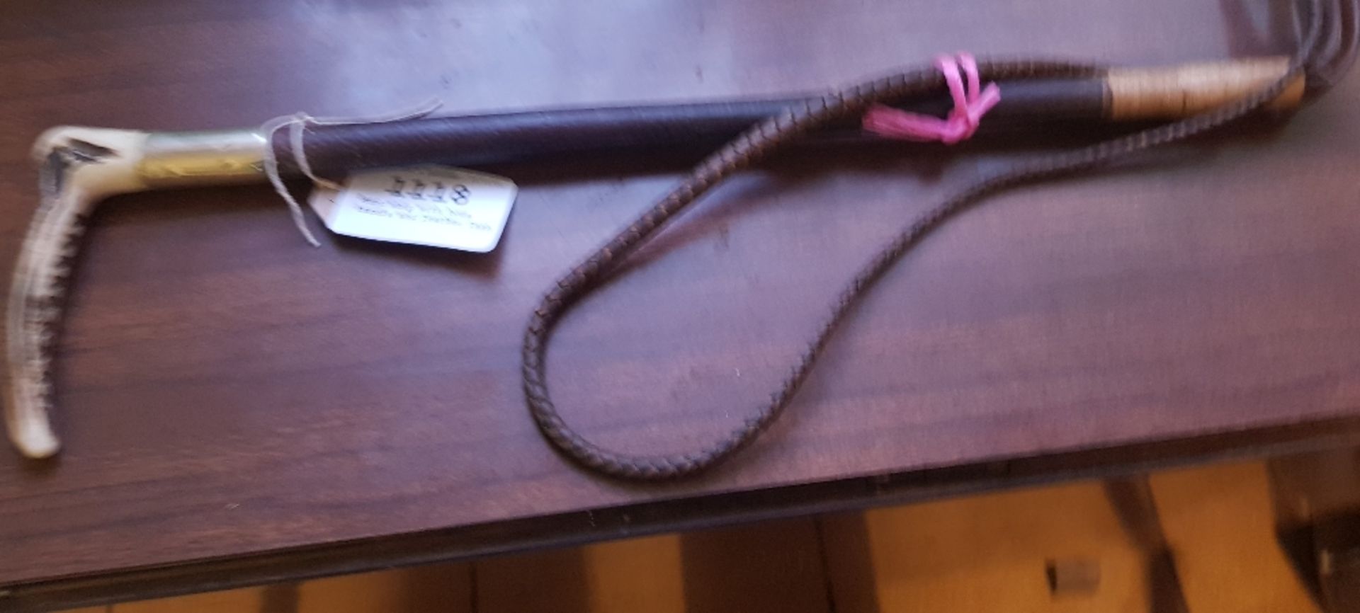 Hunt whip with bone handle and leather thong
