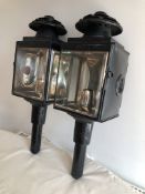 An unusual pair of black/white metal carriage lamps by Cockshoot & Co., Manchester,