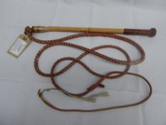 Australian stock whip with leather plaited grip and similar thong.