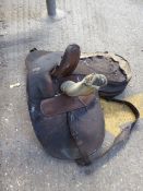 Old pack saddle and a side saddle, both requiring complete renovation