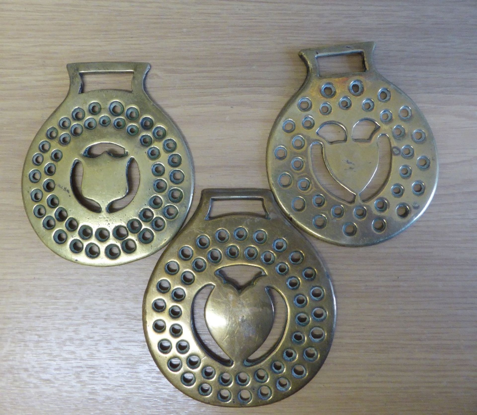 1 heart centre cast brass and 2 stamped with shield centres