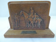 Wooden trophy bearing a copper plate