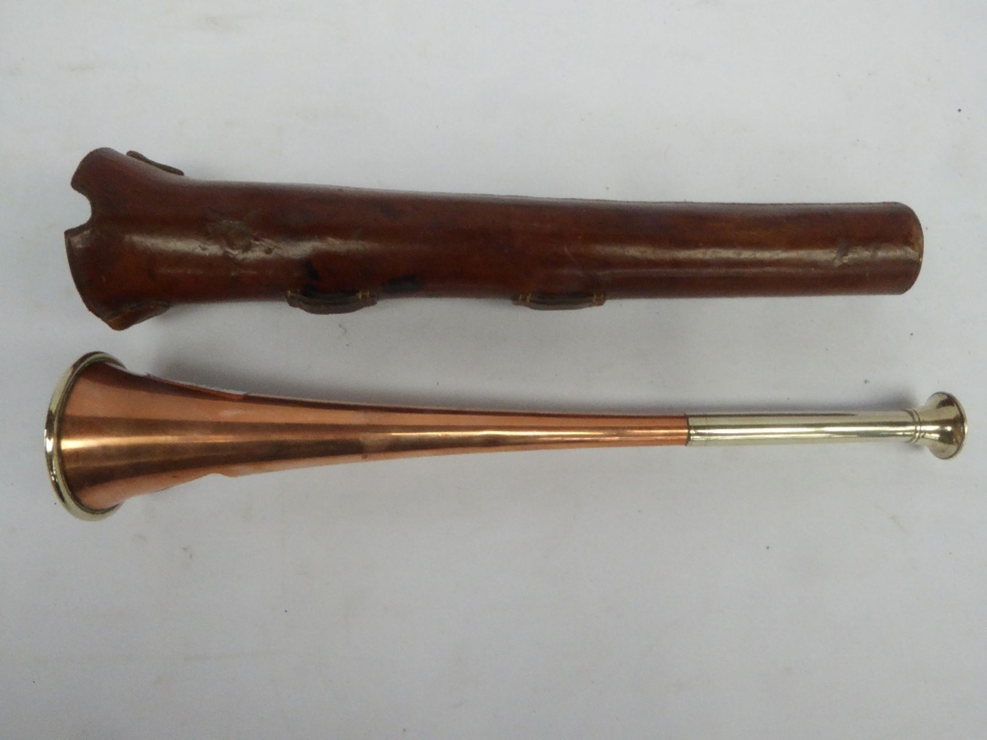 Copper hunt horn with nickel ferrule and mouthpiece, complete with leather case