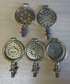 5 brass terrets of various perforated designs