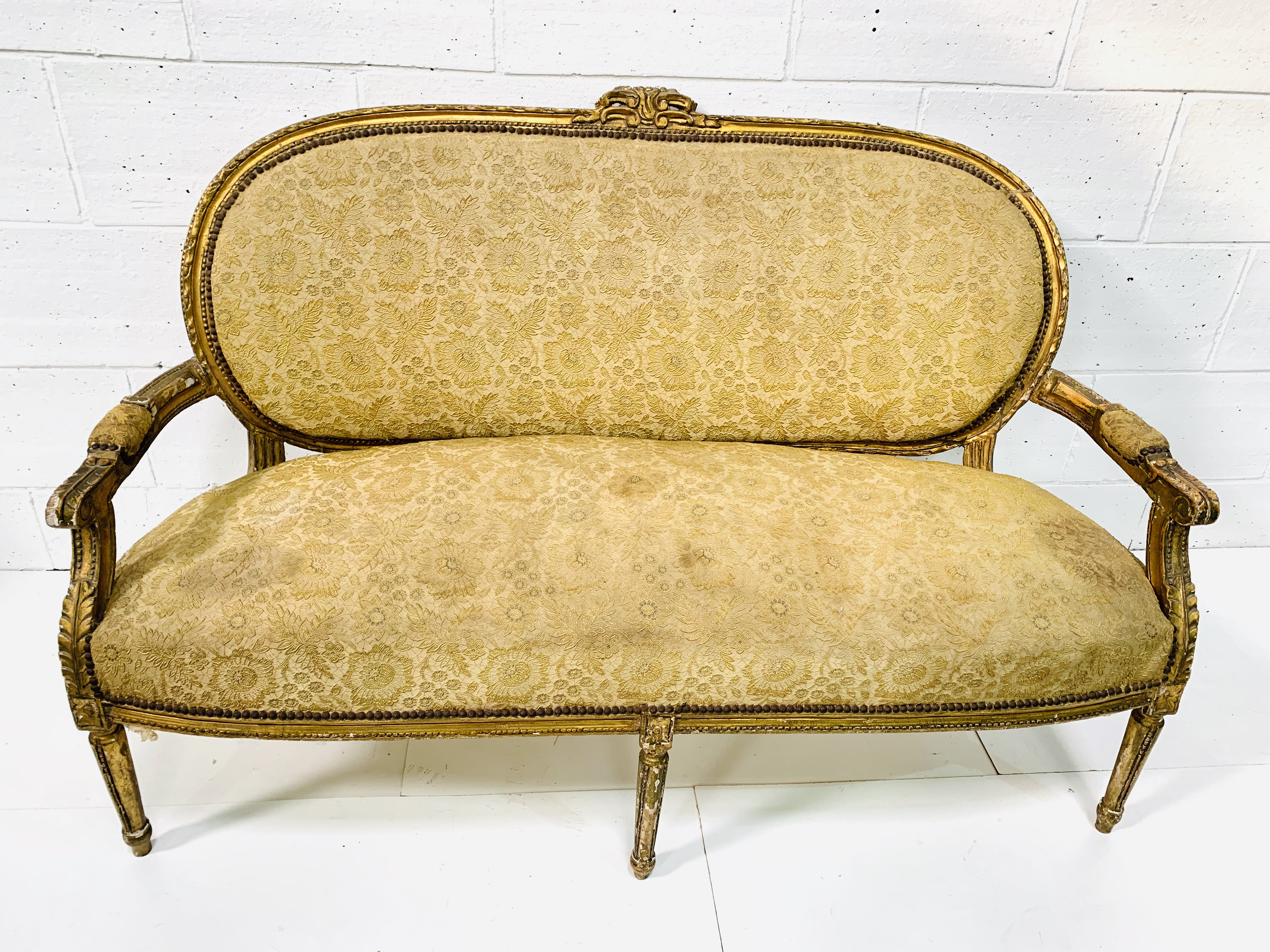 Regency gilt carved framed salon sofa.