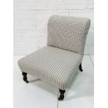 Victorian check fabric upholstered nursing chair on ceramic casters.
