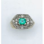 Hexagonal diamond and emerald platinum ring. Size N 1/2 Wt 9.7gms Centre emerald 6.4mm x 5.7mm. E