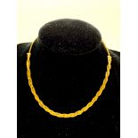 750 gold woven necklace, length 35cms, weight 11.2gms.