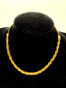 750 gold woven necklace, length 35cms, weight 11.2gms.