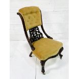 Ornately decorated mahogany framed drawing room chair with buttoned back mustard upholstrey.
