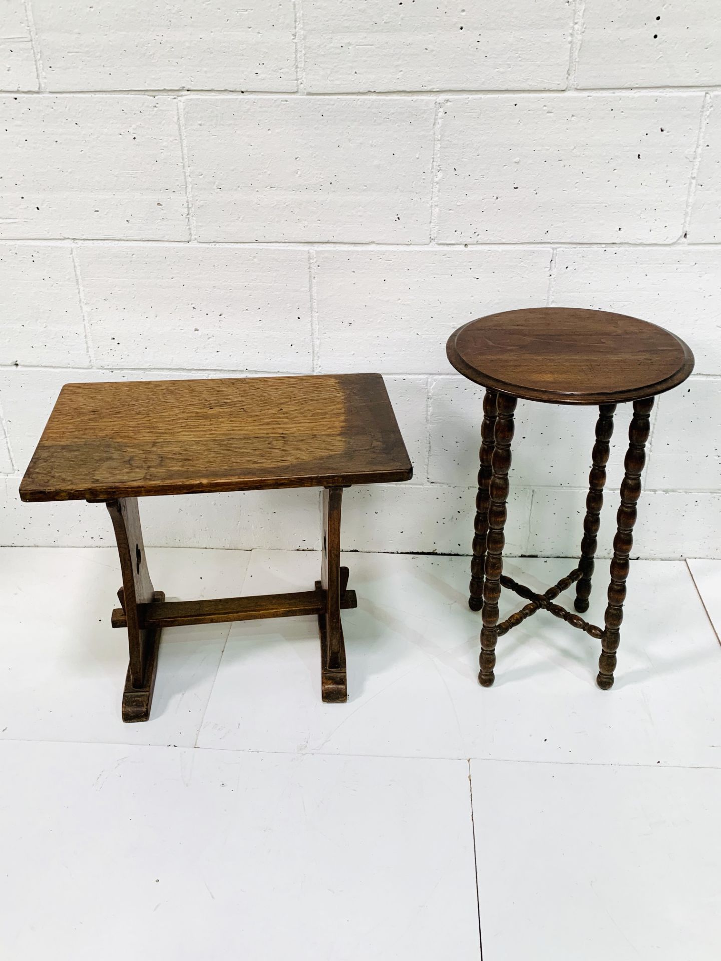 Oak pegged low table with stretcher, together with a mahogany circular display table.