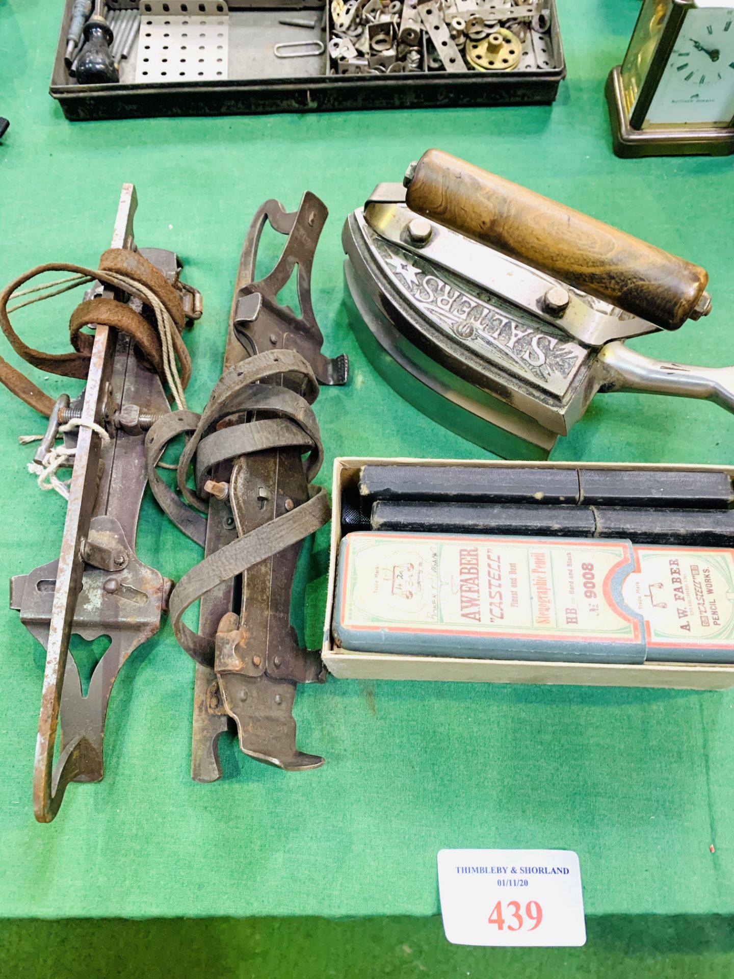 Salters gas iron; seven cut throat razors and a pair of strap on ice skates.