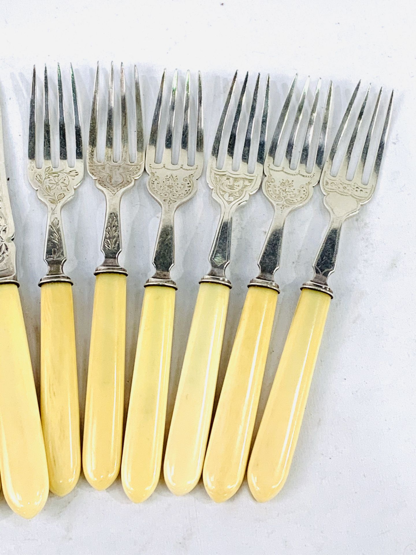 A Harlequin set of 6 pairs of mid Victorian bone handled fish knives and forks