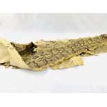 Three antique taxidermy python snake skins.