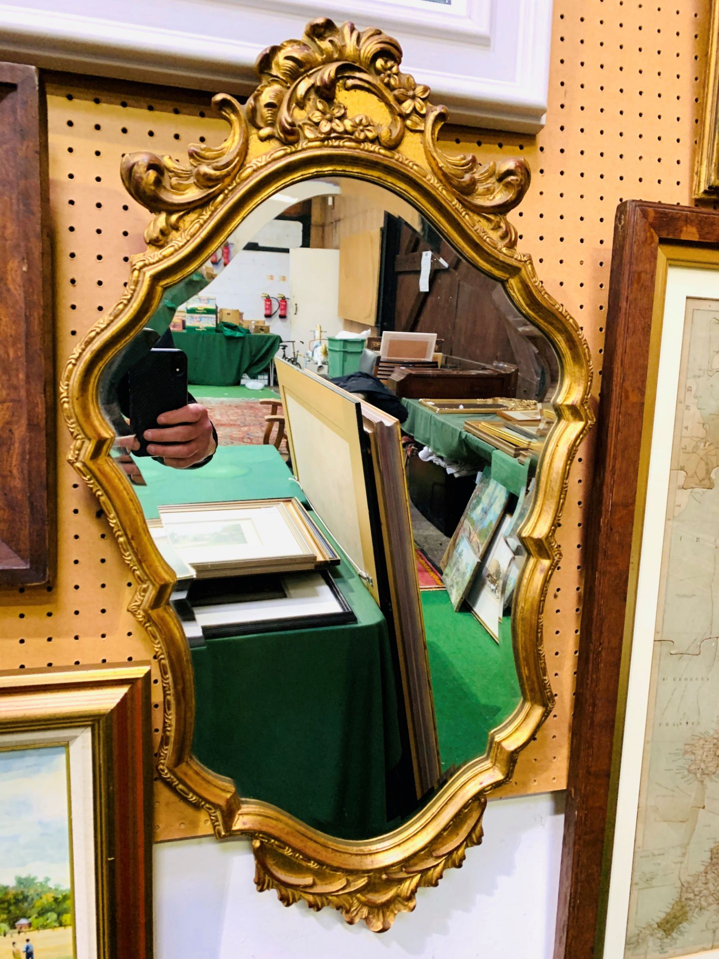 Baroque gilt frame mirror with scalloped and bevelled edge glass.