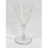 An 18th Century cut and engraved wine glass.