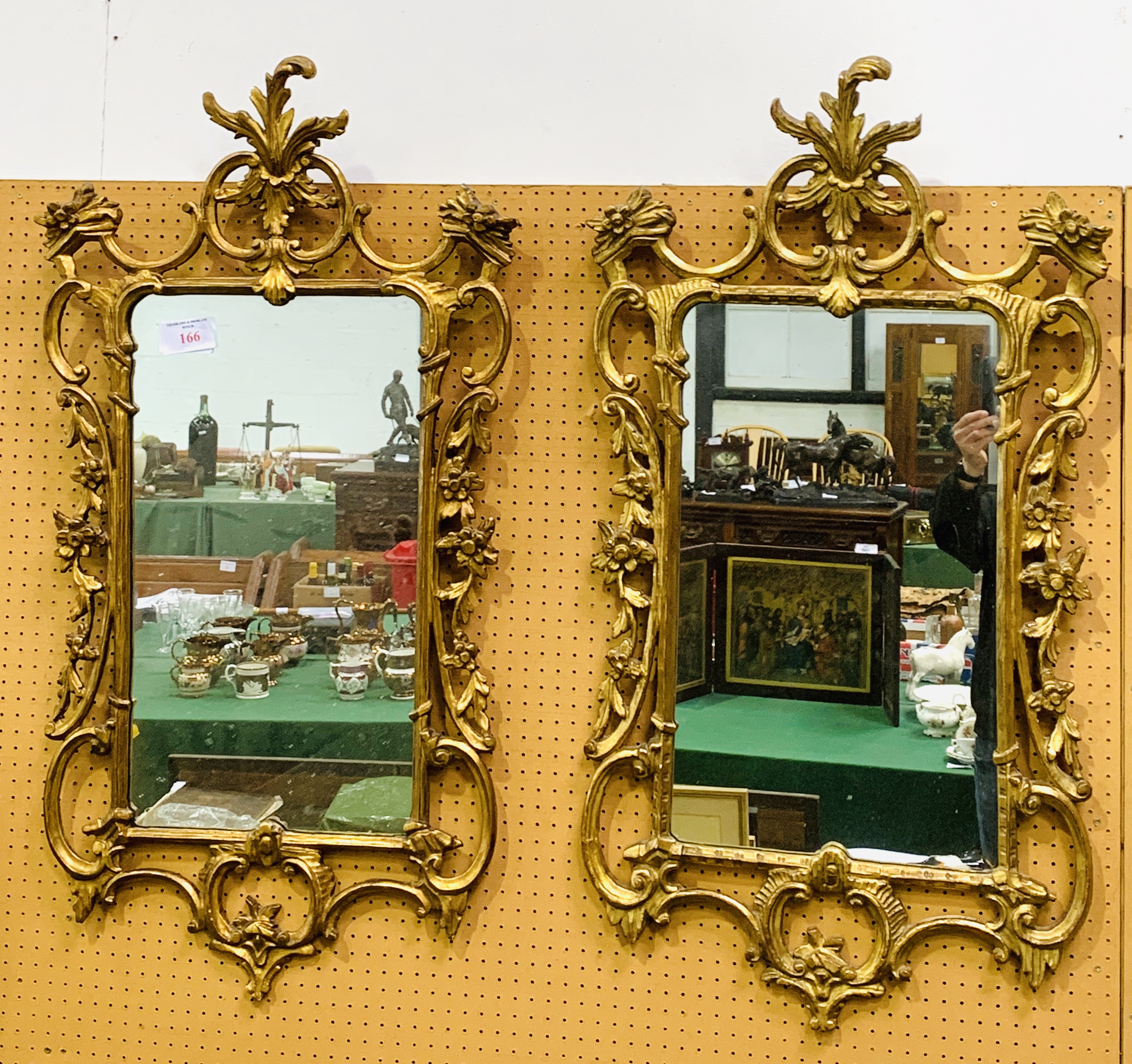 Two Georgian wall mirrors with ornately carved gilt plaster frames