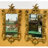 Two Georgian wall mirrors with ornately carved gilt plaster frames