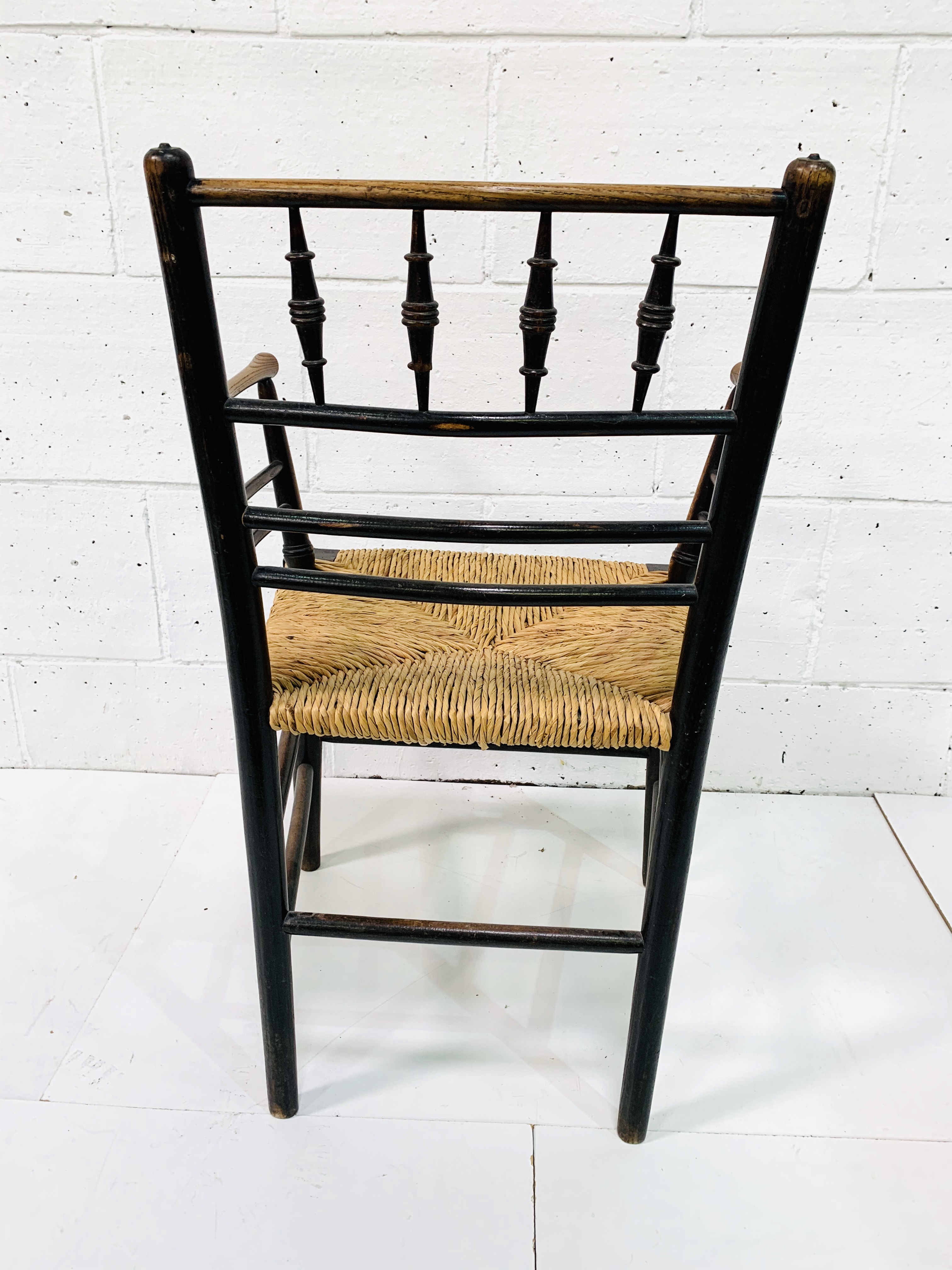A late Victorian Morris & Co. ‘Sussex’ chair oak framed rail back open arm chair. - Image 5 of 5