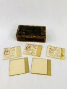 Small wooden box containing five booklets of gold and silver foil by Geo Whiley Ltd