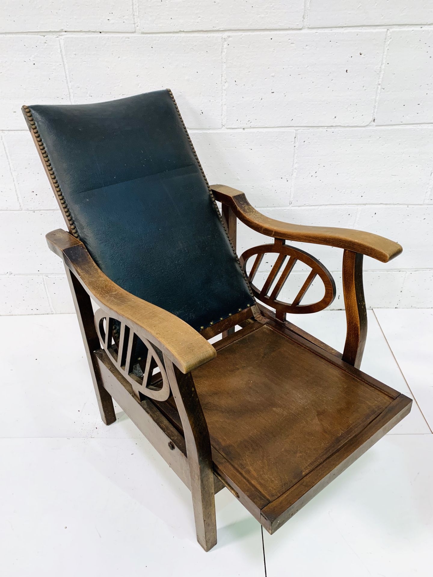 Edwardian mahogany reclinable open arm chair.