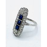 White gold diamond and sapphire triology ring. Size M. Wt 6.4gm. Length 29.2mm x 11.2mm.