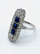 White gold diamond and sapphire triology ring. Size M. Wt 6.4gm. Length 29.2mm x 11.2mm.