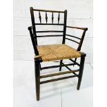 A late Victorian Morris & Co. ‘Sussex’ chair oak framed rail back open arm chair.