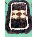 2 Alpacca fleece rugs, 140 x 100cms and 140 x 55cms.