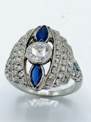 Art Deco white gold diamond and sapphire ring. Size O 1/2 Wt. 7.8gms. Size of centre diamond 6.3m