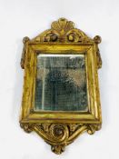 18th century gilt framed candle mirror with carved pediment