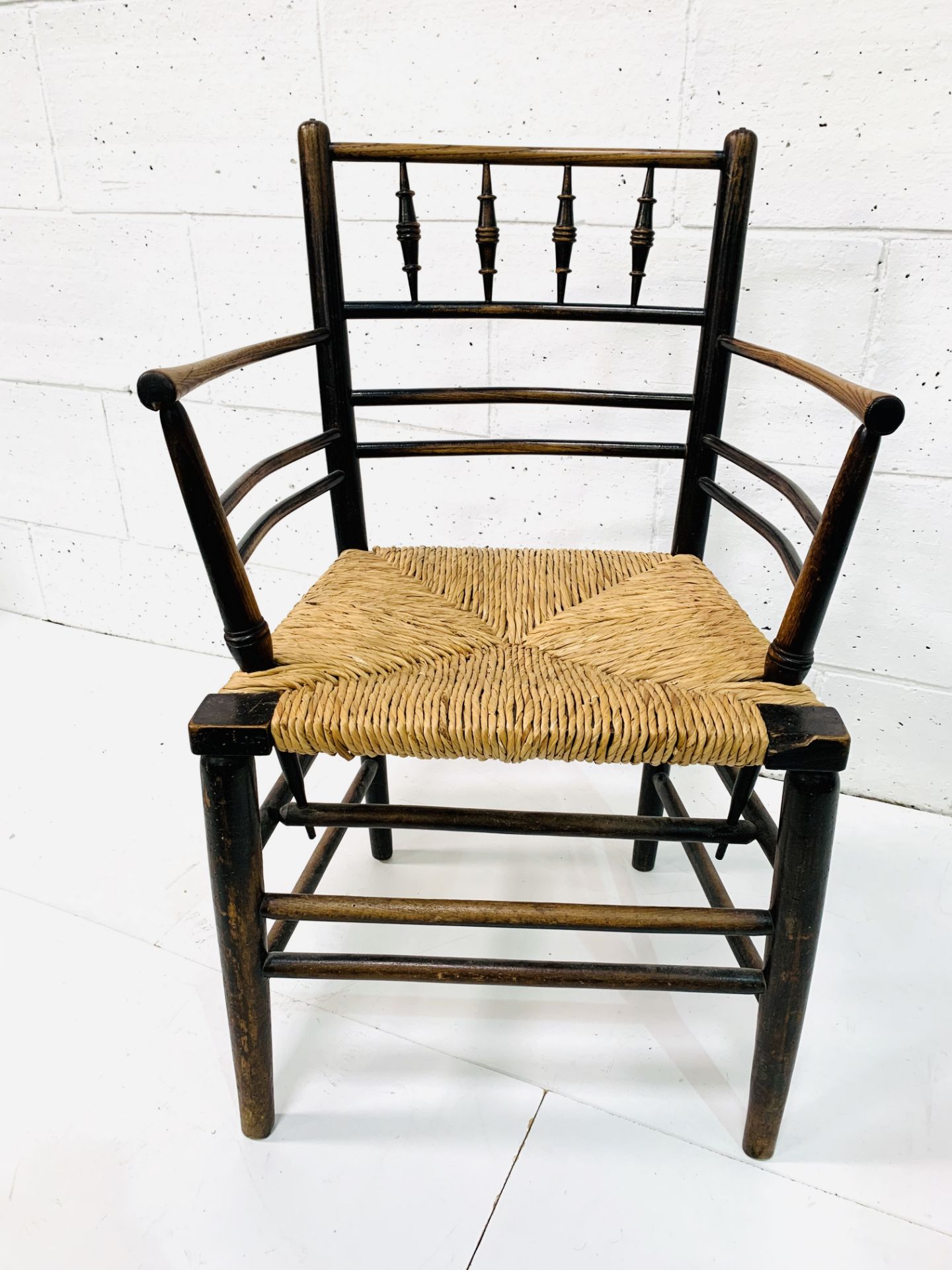 A late Victorian Morris & Co. ‘Sussex’ chair oak framed rail back open arm chair. - Image 2 of 5