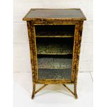 Bamboo glass fronted decorative display cabinet.