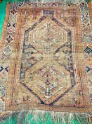 Brown ground hand knotted Middle Eastern rug.