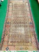 Brown ground hand knotted Middle Eastern rug.