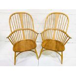 Two Ercol rail back elbow chairs.