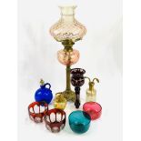 Brass oil lamp with pale pink shade; pair of ruby cut bowls and a glass; and other glass ware