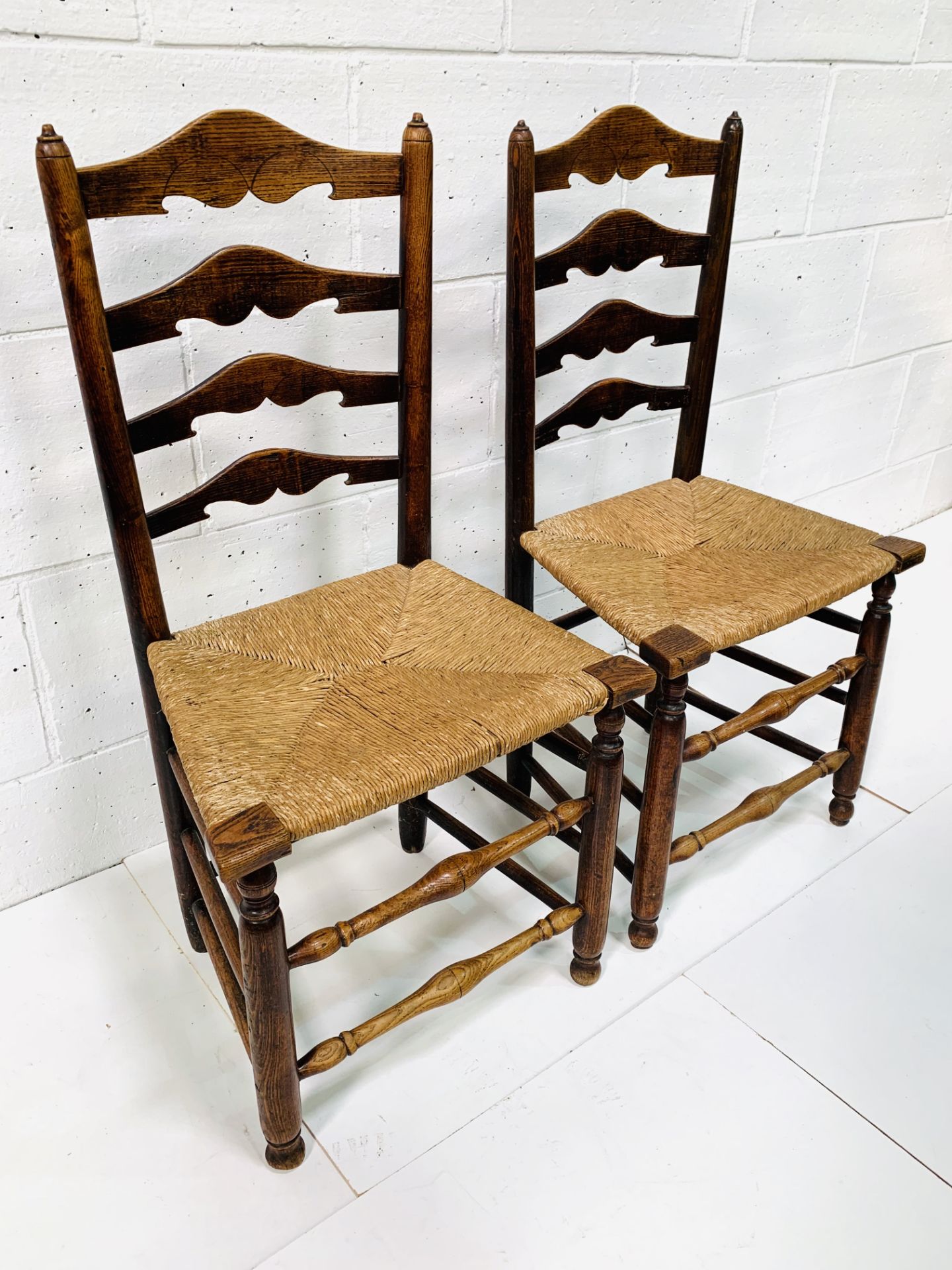 Two oak framed ladder back chairs with string seats. - Image 3 of 6