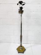 Decorative silver plate on brass floor standing oil lamp, converted to electricity