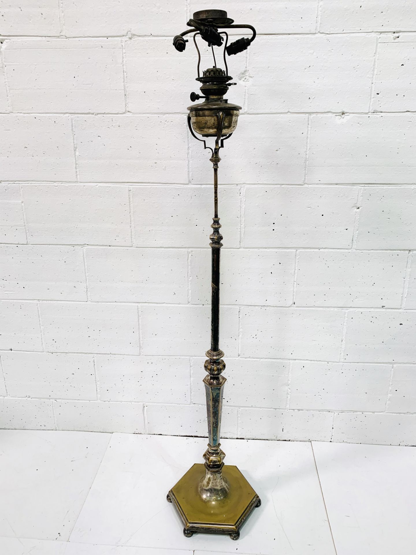 Decorative silver plate on brass floor standing oil lamp, converted to electricity