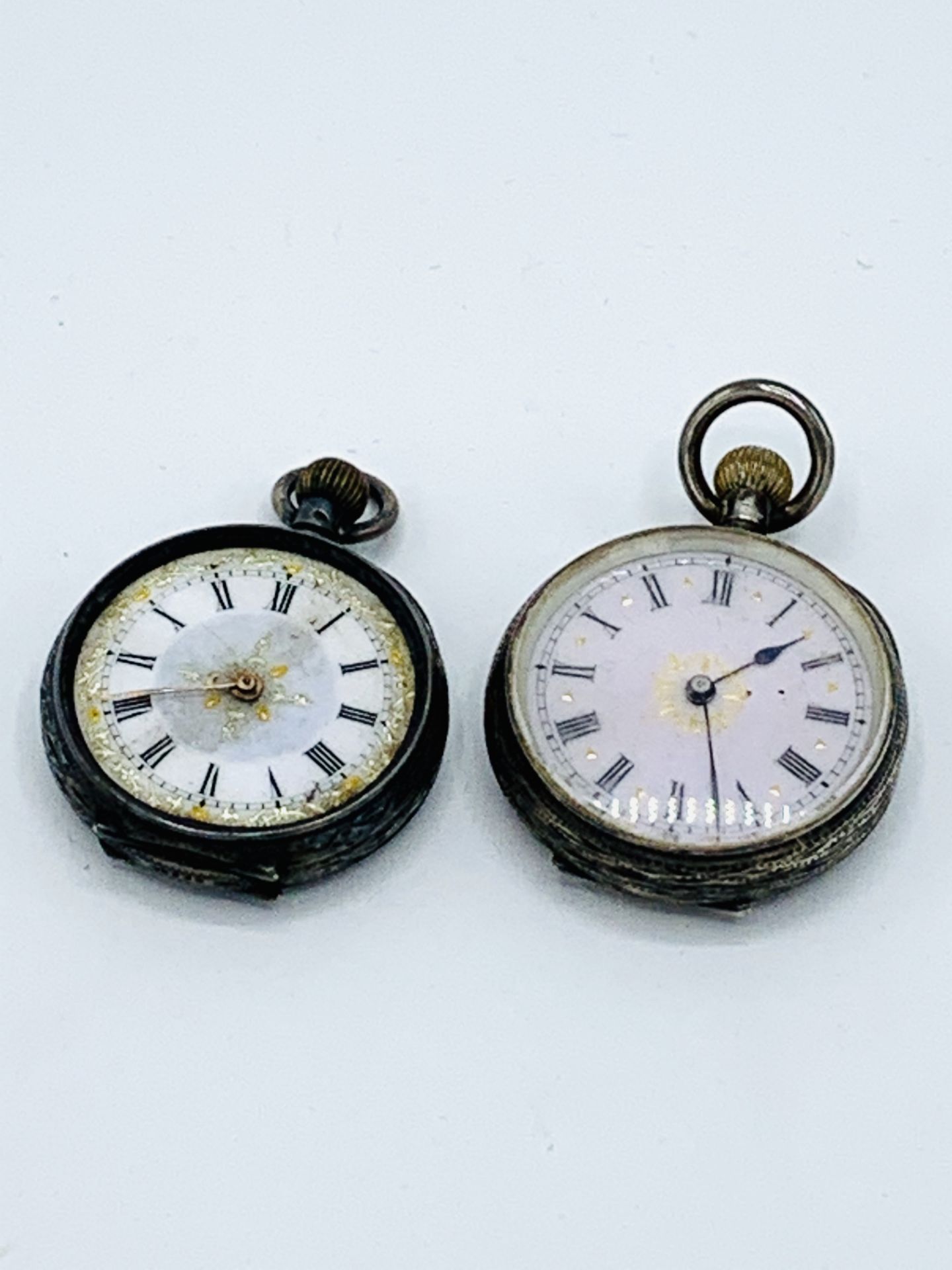 Small 935 silver case pocket watch, going; together with another similar, for spares