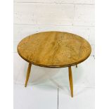 Ercol style circular coffee table, 79 x 43cms.