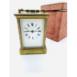 Brass case carriage clock marked ACCL, with original case, and key, going