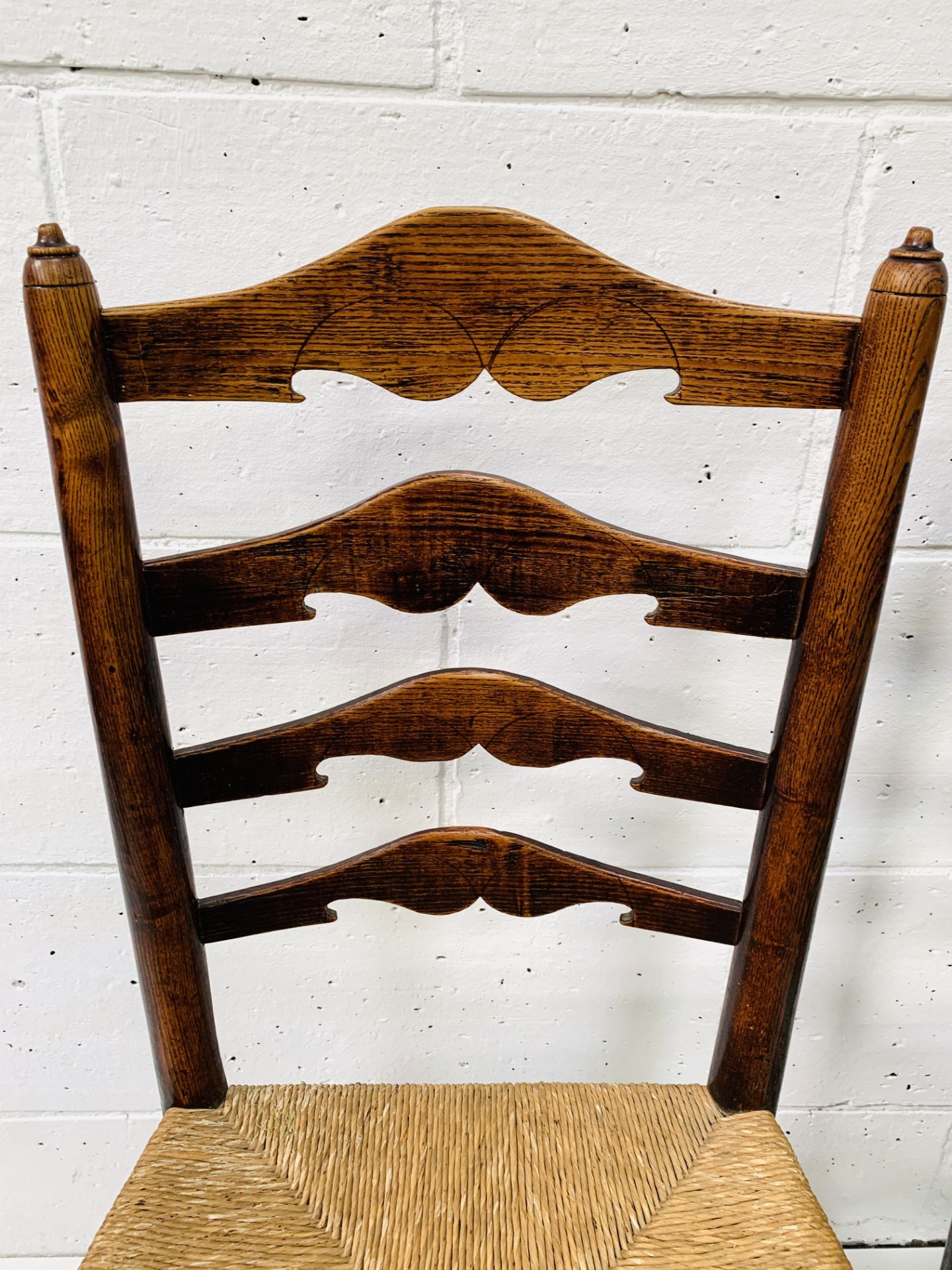 Two oak framed ladder back chairs with string seats. - Image 5 of 6