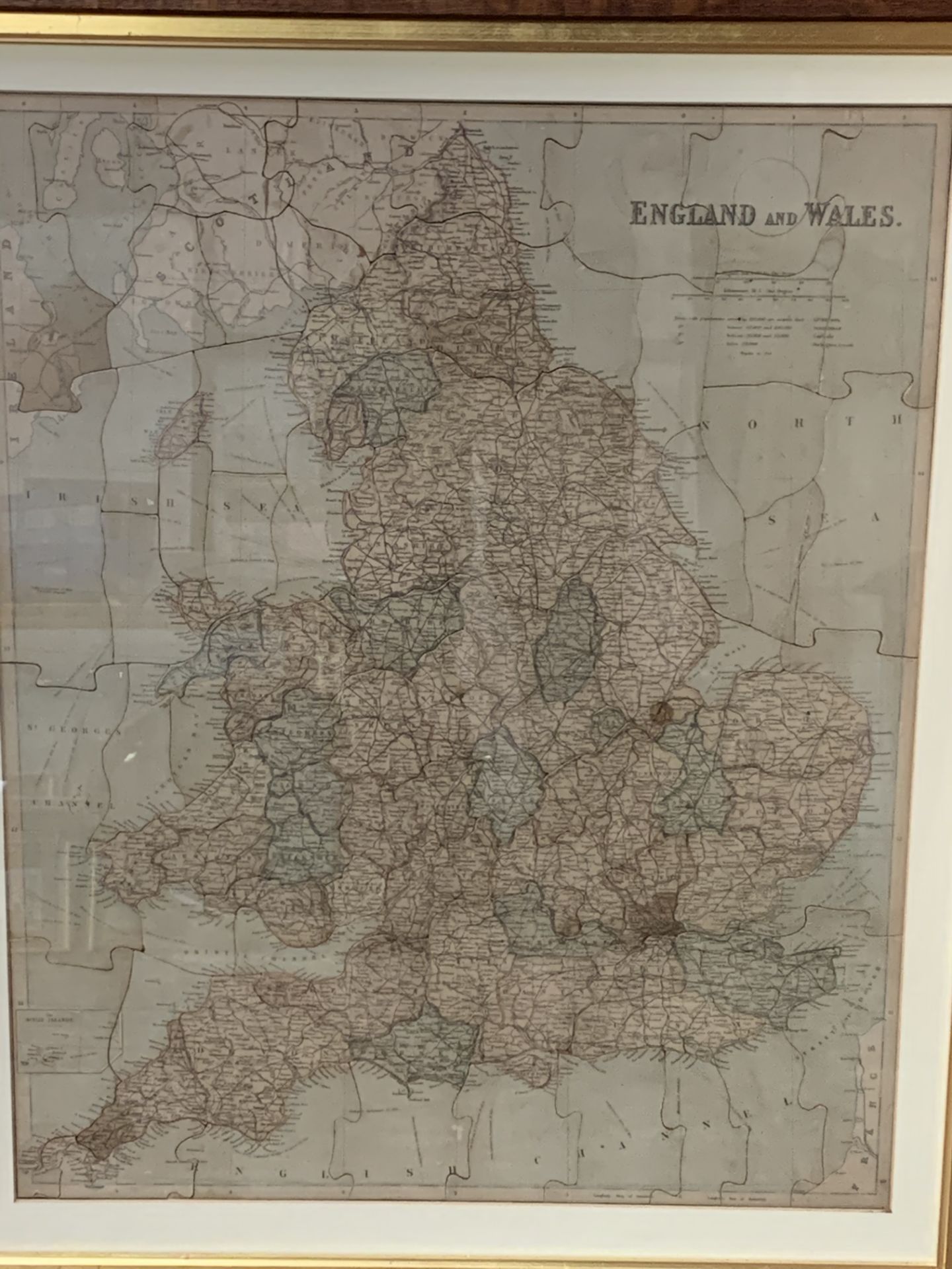 Framed and glazed jigsaw map of England and Wales, showing all the counties.