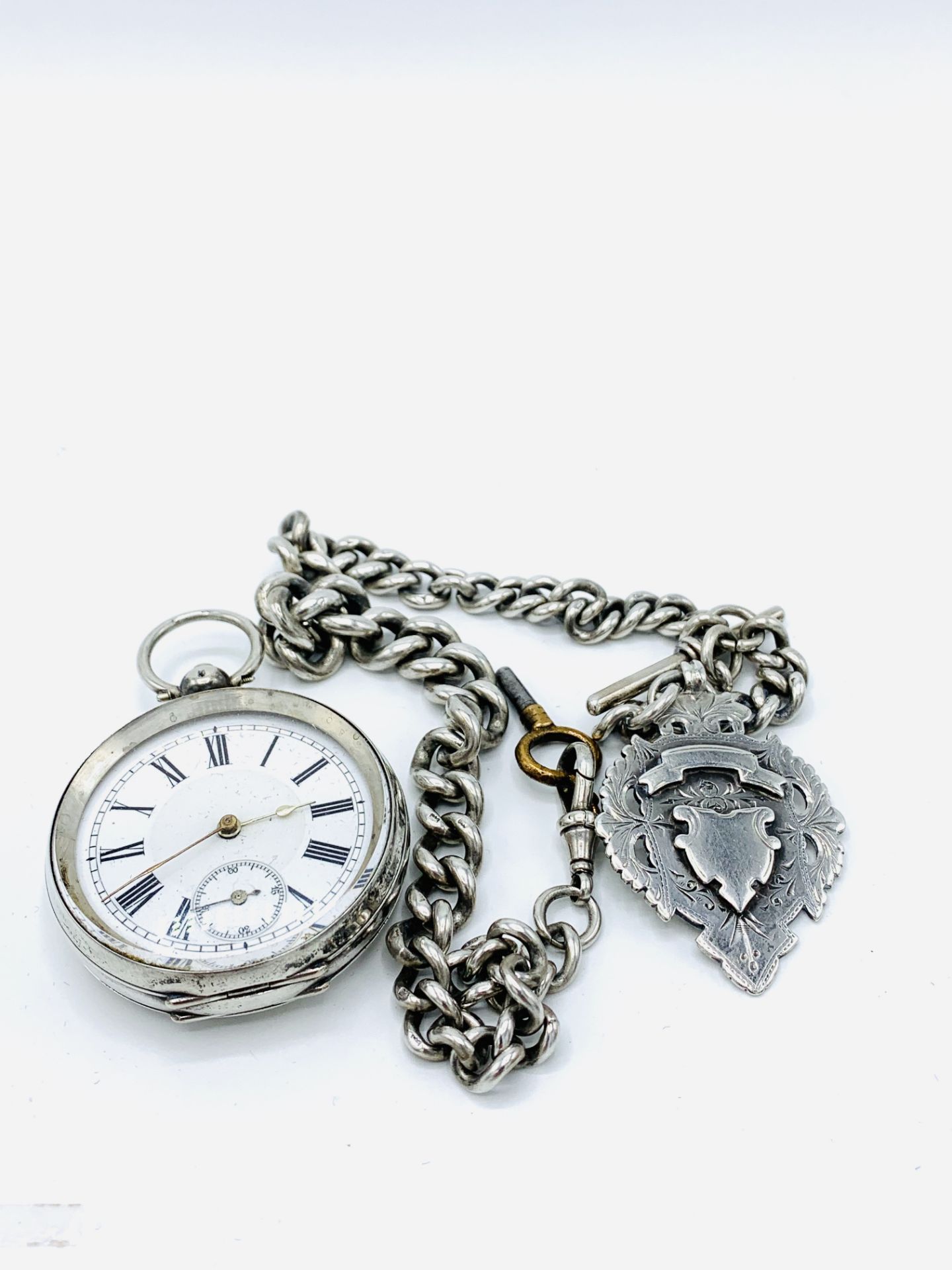 935 silver case pocket watch, together with a hallmarked silver fob chain and silver pendant