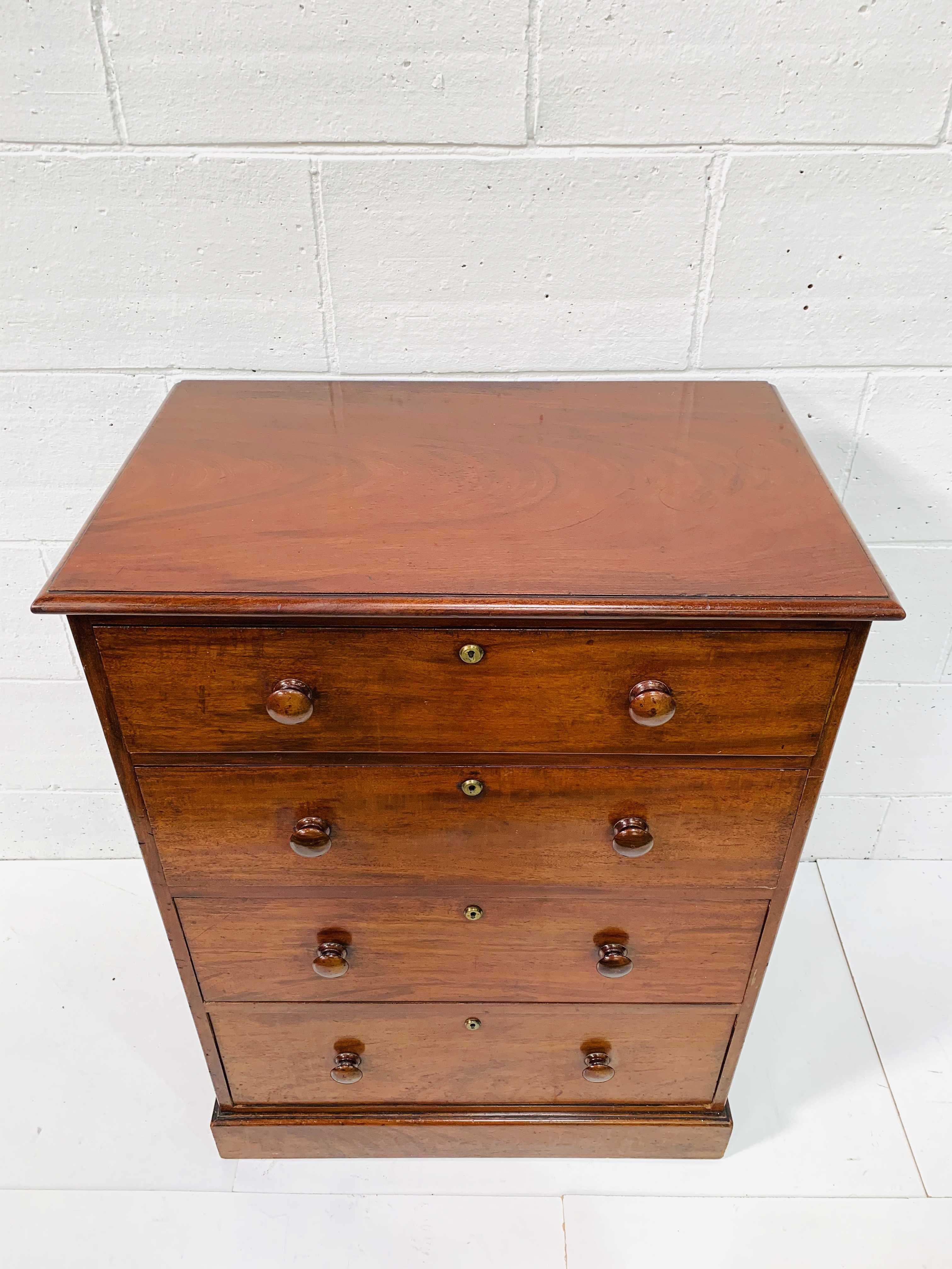 Mahogany chest of four graduated drawers by Spillman and Co. - Image 4 of 8