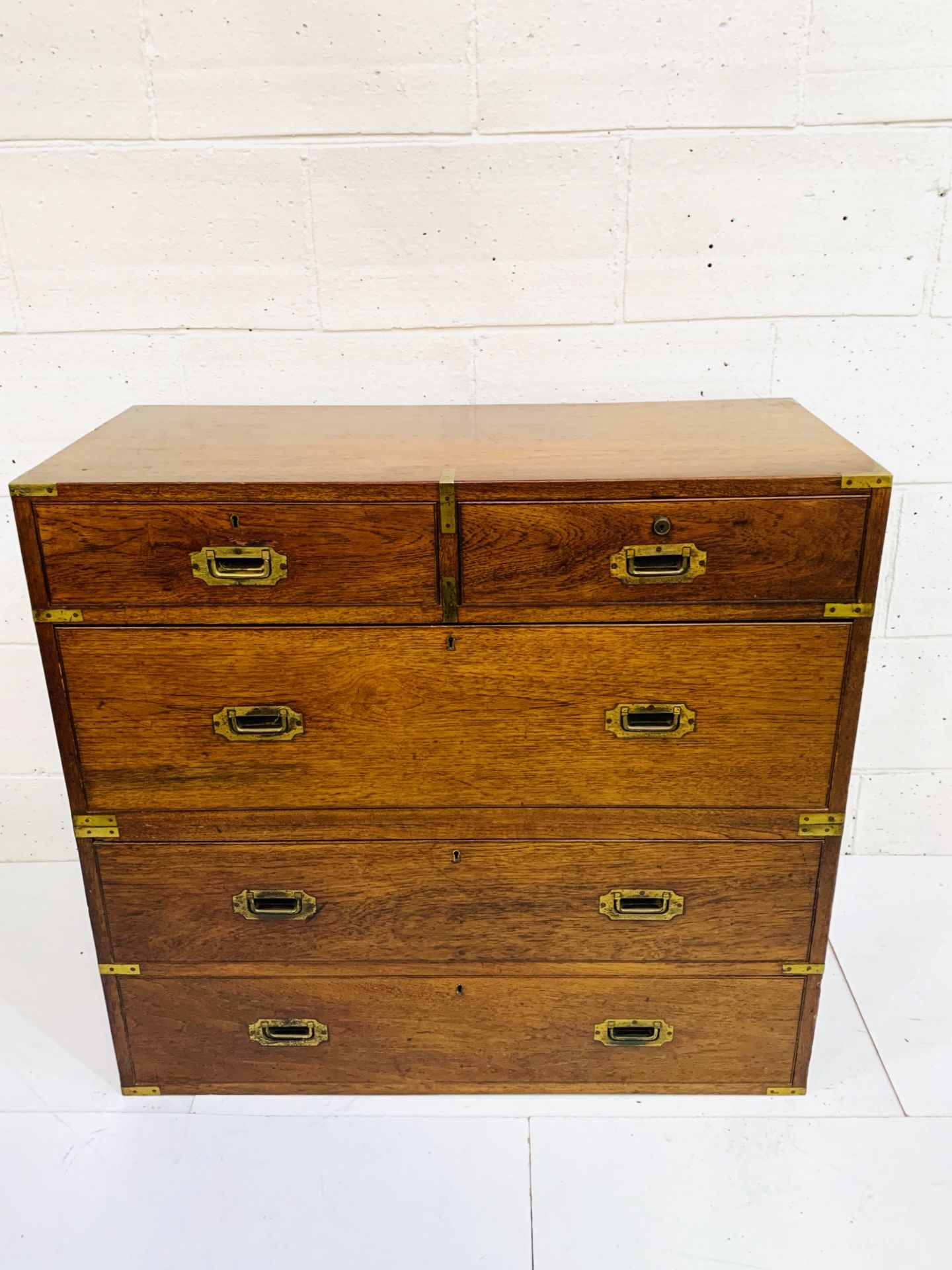 19th Century brass bound oak "Campaign" chest of two over three drawers, divides in the middle.
