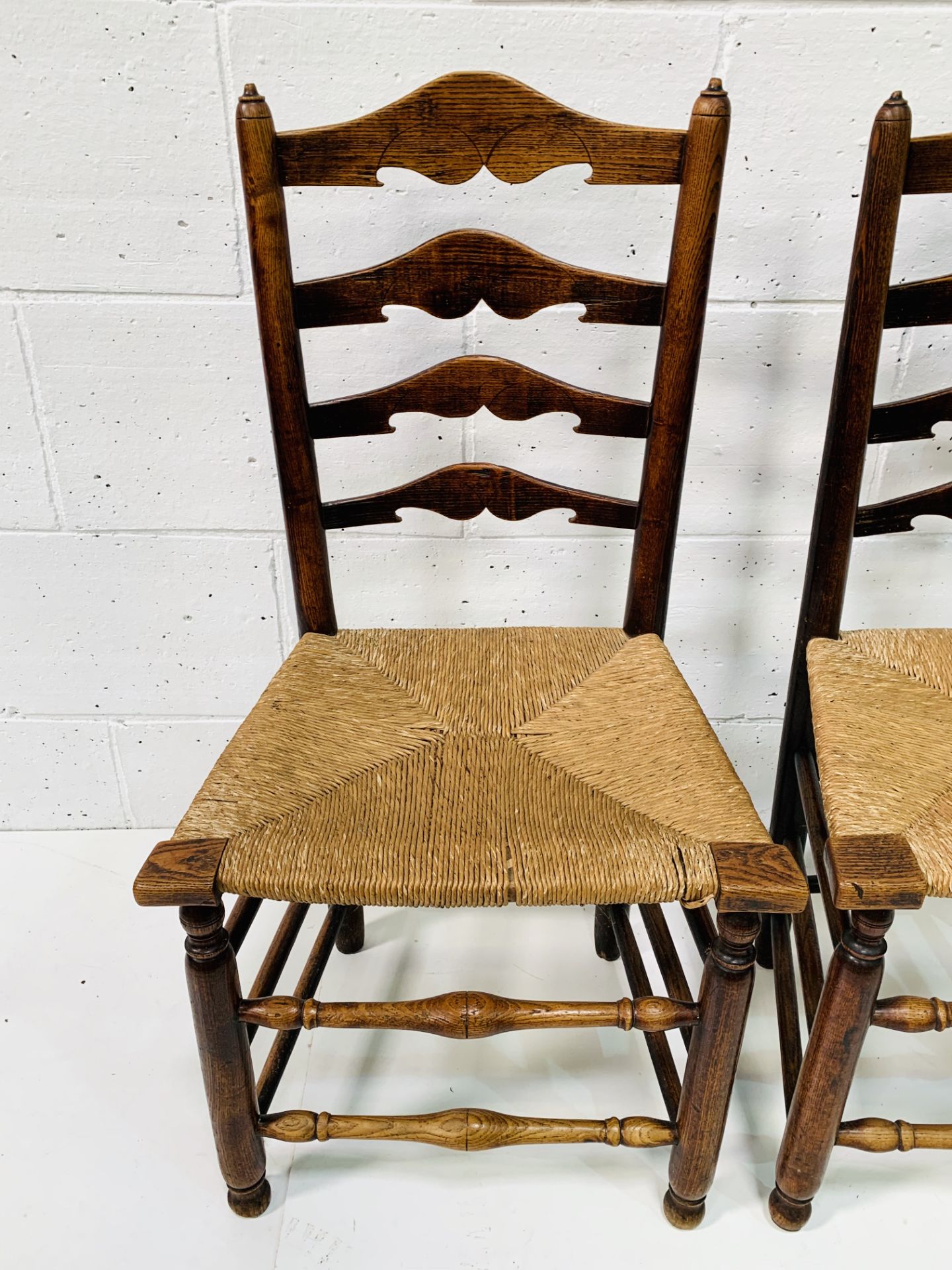 Two oak framed ladder back chairs with string seats. - Image 2 of 6