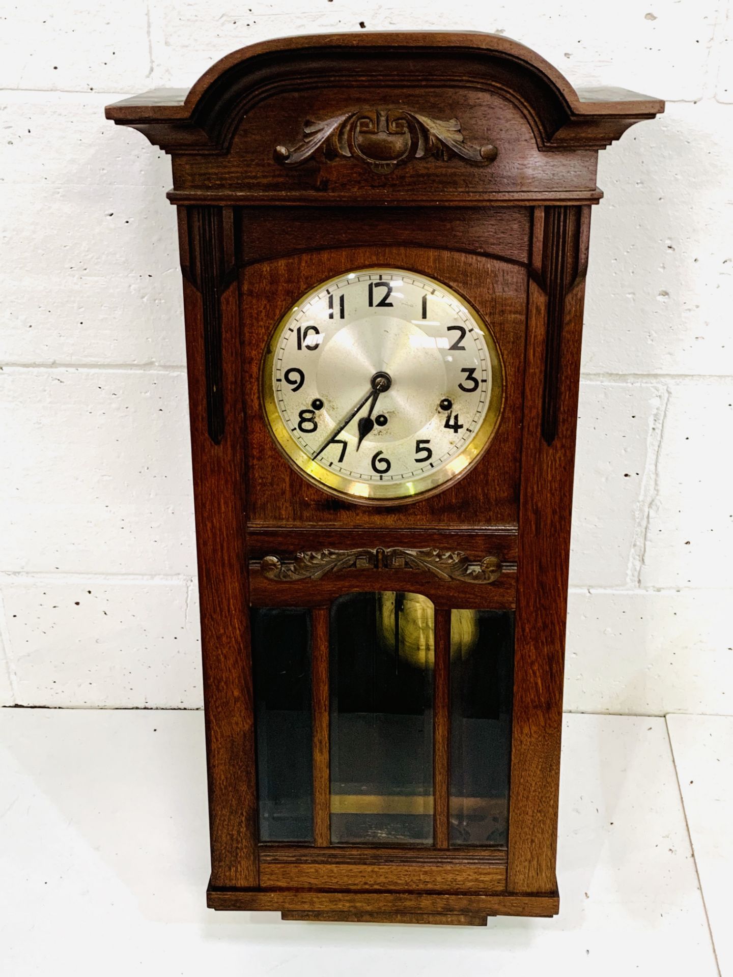 Mahogany case pendulum wall clock, going.